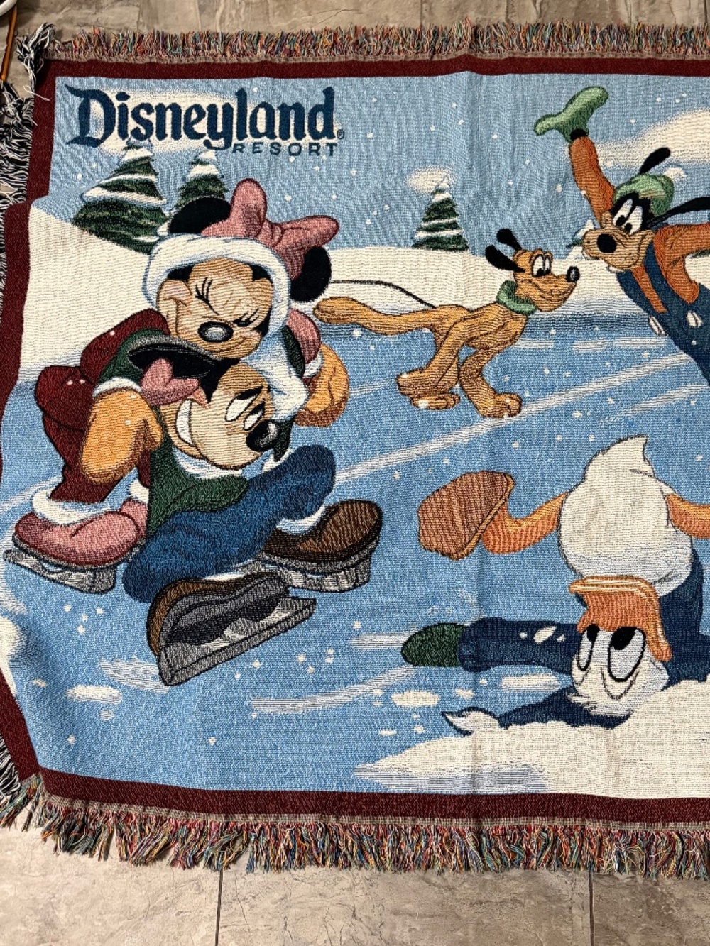 The Disneyland Mickey & Friends Ice-Skating Christmas Tapestry Throw Blanket
